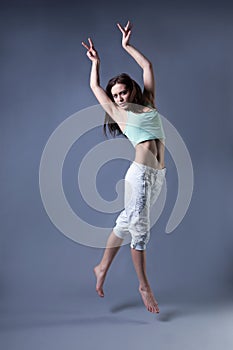 Beauty girl dance on grey background