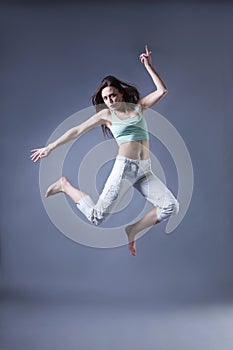 Beauty girl dance on grey background