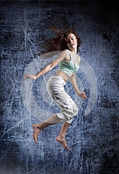 Beauty girl dance on grunge background