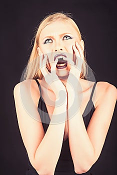 Beauty Girl Face. Studio Shot of Woman. Manicure and fashion Makeup. Beautiful lady touching her face