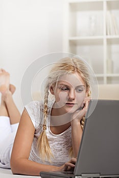 Beauty girl with laptop in room