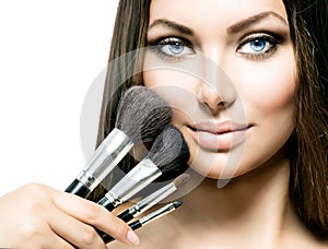 Beauty Girl with Makeup Brushes