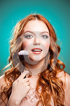 Beauty Girl with Makeup Brushes