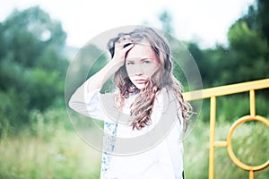 Beauty Girl Outdoors enjoying nature. Teenage Model girl running on the Spring Field, Sun Light.