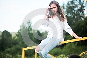 Beauty Girl Outdoors enjoying nature. Teenage Model girl running on the Spring Field, Sun Light.