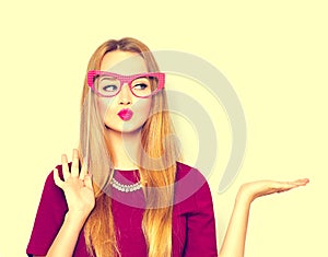 Beauty girl with paper glasses on stick showing empty copyspace