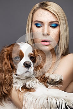 Beauty girl with a perfectly straight hair and a dog. Beauty face