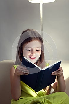 Beauty girl read book on sofa