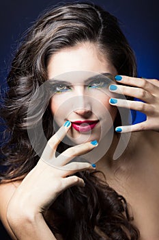 Beauty Girl with Red Lips and blue Nails