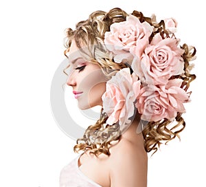 Beauty girl with rose flowers hairstyle