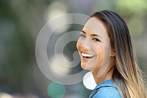 Beauty girl smiling with perfect teeth on the street