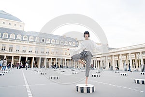 Beauty girl stand in yoga pose in paris, france.