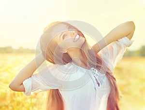 Beauty girl on summer field