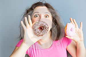 Beauty girl taking colorful donuts. Funny joyful woman with sweets, dessert. Diet, dieting concept. Junk food