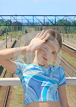 Beauty girl on train rails landscape background