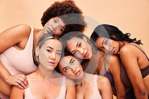 Beauty, group and portrait of women with makeup for cosmetic skincare isolated in a studio brown background. Diversity