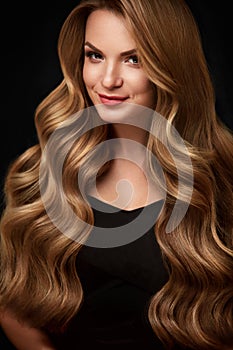Beauty Hair. Beautiful Woman With Curly Long Blond Hair
