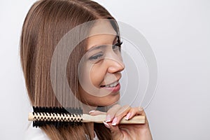 Beauty Hair Care, Beautiful Woman Combing Long Natural Hair