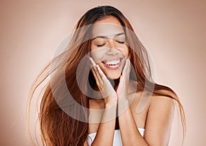 Beauty, hair care and face of woman with eyes closed in studio on brown background. Skincare, makeup cosmetics or female