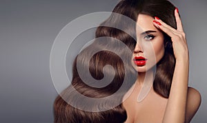 Beauty hair girl portrait. Red lips makeup, manicure nails and h