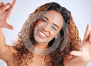 Beauty, hair and selfie with face of woman in studio on gray background for aesthetic or wellness memory. Photograph