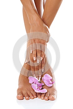 Beauty, hands and feet with orchid and woman in manicure and pedicure zoom, skincare with glow against white background