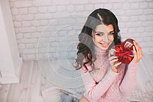 Beauty happy girl with Valentine gift box.