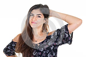 Beauty happy smiling young beautiful woman isolated over white background looking at camera hand on hair head