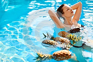 Beauty, Health Concept. Fruits, Healthy Woman In Pool. Body Care