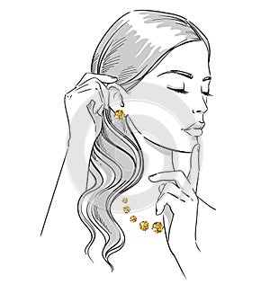 Beauty illustration. Fashion portrait of a woman with hands at her face wearing golden jewellery