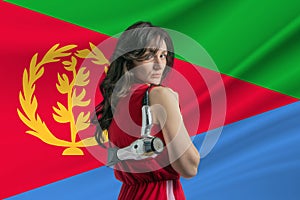 Beauty industry in Eritrea Happy female hairdresser holding hairdryer against Eritrea flag background