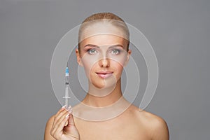 Beauty injection in a face of a young woman. Plastic surgery concept.