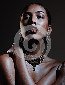Beauty, jewellery and portrait of a woman in a studio with elegant, fancy and stylish accessories. Cosmetic, style and