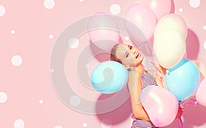 Beauty joyful teenage girl with colorful air balloons