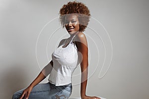 Beauty latin woman wearing jeans and white top