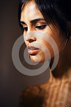 beauty latin young woman in depression, hopelessness look, fashi