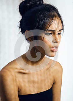 Beauty latin young woman in depression, hopelessness look, fashion make up dark style