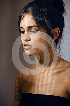 beauty latin young woman in depression, hopelessness look, fashion makeup modern