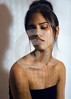 beauty latin young woman in depression, hopelessness look, fashion makeup modern