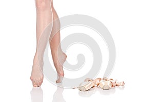 Beauty legs of ballerina standing on tiptoes near pointes.