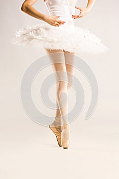 Beauty legs of ballerina on white