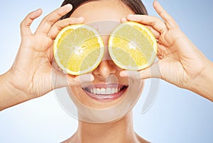 Beauty, lemon and woman with face and natural product, organic and vegan facial detox for skin against studio background