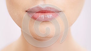 Beauty, lips and makeup with woman closeup in studio on purple background for mouth cosmetics. Skincare, lipstick and