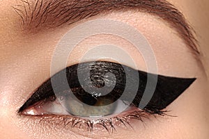 Beauty macro of eye with fashion liner make-up