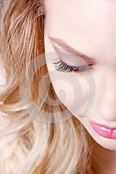 Beauty makeup for blue eyes. Part of beautiful face closeup. Perfect skin, long eyelashes, make up concept.