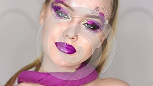 Beauty Makeup. Purple Make-up and Colorful Bright Nails. Beautiful Girl Close-up Portrait