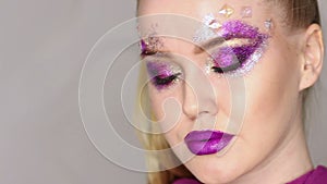Beauty Makeup. Purple Make-up and Colorful Bright Nails. Beautiful Girl Close-up Portrait