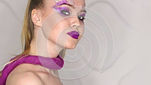 Beauty Makeup. Purple Make-up and Colorful Bright Nails. Beautiful Girl Close-up Portrait