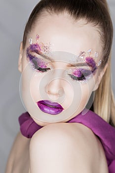 Beauty Makeup. Purple Make-up and Colorful Bright Nails. Beautiful Girl Close-up Portrait