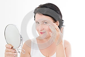 Beauty middle age woman with mirror. Face portrait. Spa and anti aging concept Isolated on white background. Plastic surgery